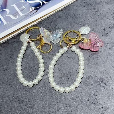 China Wholesale Custom Beauty Girl Pearl Chain Butterfly Pattern Korean Creative Key Chain Convenient Lovely for sale