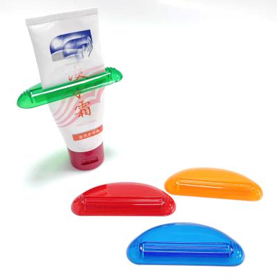 China PTTS-002 Mini Plastic Squeeze Ease Tube Fruit Squeezer Toothpaste Dispenser Viable Convenient Colorful Clip Customized Logo for sale