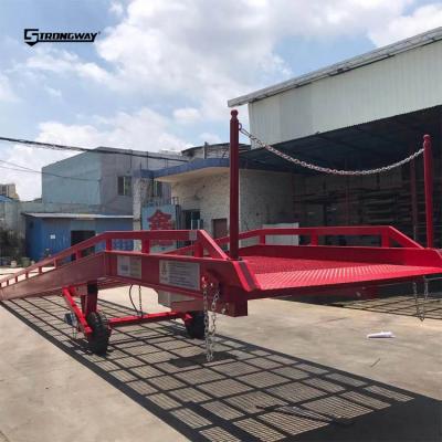 China Hotels 10 ton electric hydraulic loading dock ramp for truck loading with forklift for sale