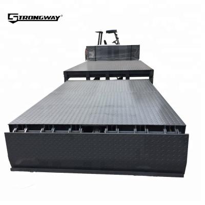 China Unloading Cargo Stationary Hydraulic Dock Leveler For Container With 10 Tons for sale