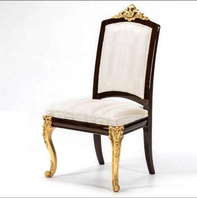 China Solid Wood Classic Italian Luxury Living Chair Classic Fabric Painted Carved Gold Dining Armless Chair for sale