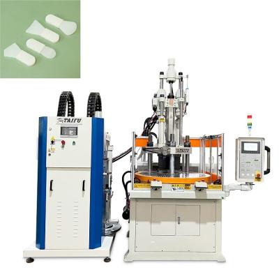 China Silicone gezichtsmasker borstelmachine roterende verticale spuitgietmachine Te koop