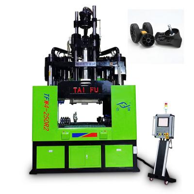 Chine Machine de moulage par injection verticale de table de 250 tonnes à faible travail pour la fabrication de roues de bagages à vendre