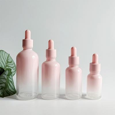 China Wholesale 5ml-100ml Cosmetic Light Pink Gradient Round 30ml Dropper Bottle 30ml Oil Dropper Bottle With Pink Lids for sale