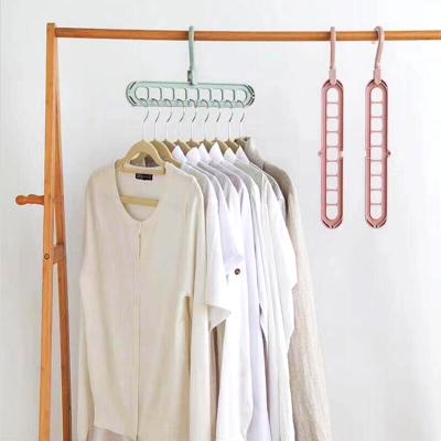 China Rotating 9 Hole Clothes Hanger Multi-Function Plastic Multi-Functional Wardrobe Space Magic Hanger for sale