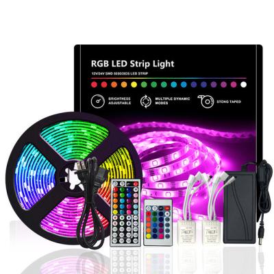 China Hot sale home 12V waterproof led strip lights 2 in 1 kit RGB 5050 10m with power adapter for sale