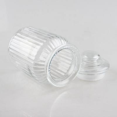 China Freshness Preservation Round Shape Vertical Stripes Embossed Airtight Glass Food Container Storage Jar for sale