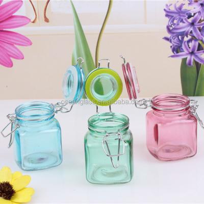 China Free Sample Viable Mini Square Glass Spice Jar Cosmetic Jars With Clip Lid /colored Glass Square Jar With Clip Lid for sale