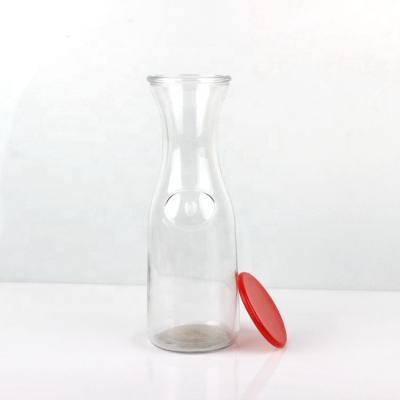 China Sustainable High Quality Wholesale Round 1000ml Carafe Glass Bottle For Juice Drinking for sale