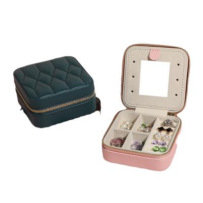 China Portable Ring Earring Box Jewelry Travel Storage Box Leather Pilou Bag Jewelry Box for sale