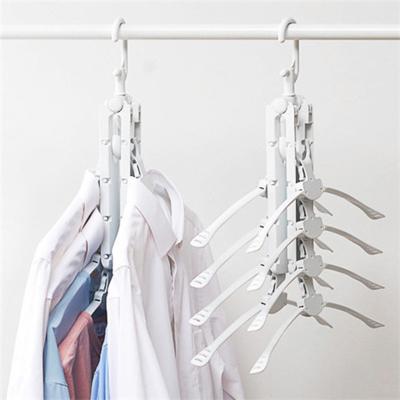 China Multifunctional 8 in 1 Magic Folding Clothes Hangers Folding Drying Clothes Rack for Travel Home Camping for sale