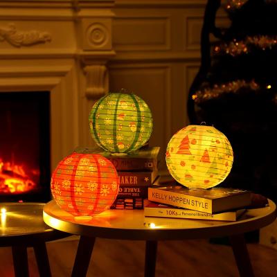 China Christmas Lemon White Christmas Decorations Red Green Party Supplies LED Paper Lantern Light Santa Hats Snowflake Round for sale