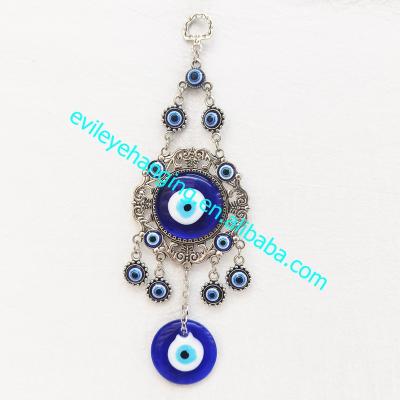 China Evil eye; Traditional Amulet Carving Pattern Blue Evil Eye Wall Hanging Decoration For Metal Crafts Souvenir And Gift for sale