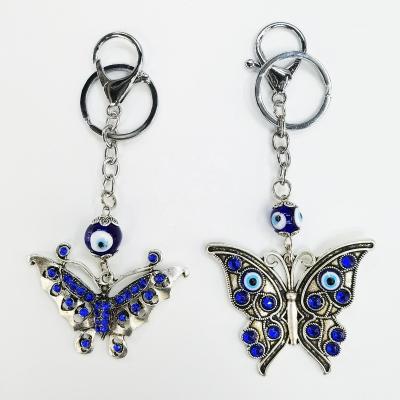 China Art Key Chain Folk Butterfly Evil Eye For Backpack Pendants Palm Drop Oil Key Chain for sale