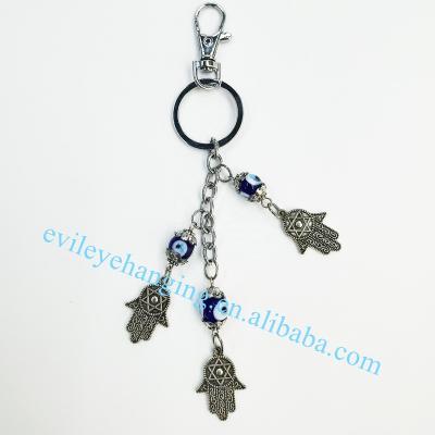 China Fatima Hamsa Hand Backpack Pendants Evil Eye Hanging Key Chain Key Chain for sale