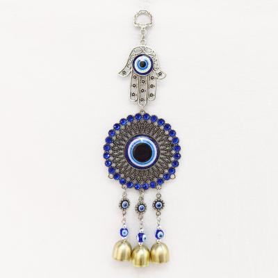 China Zinc Alloy Metal Israeli Fatima Hamsa Crystal Mosaic Wind Chime Wall Hanging Hand of the Evil Eye Amulet Glass Blue Pendant for sale