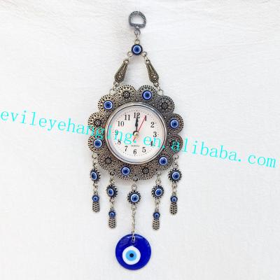 China Antique Sign Metal Opens Clock Wall Hanging Decoration with Evil Eye Glass Bead for Metal Souvenir Home Decorative Clock for sale