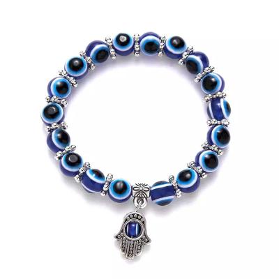 China Durable Fatima Hamsa Hand Blue Eye Hand With Evil Eye Resin Alloy Bracelet for sale