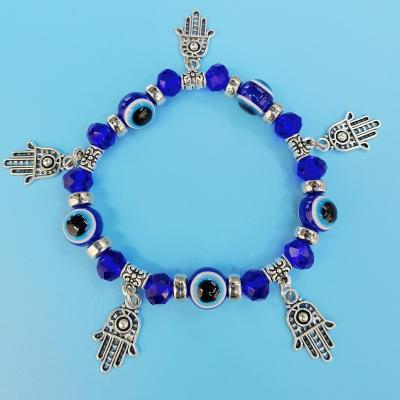 China Durable Fatima Hamsa Hand Blue Eye Hand With Evil Eye Resin Alloy Bracelet (Accept Custom Design) for sale