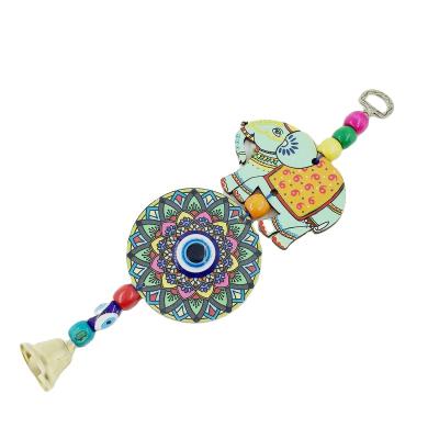 China Bell Art Blue Folk Eye Elephant Wooden Pendant for sale