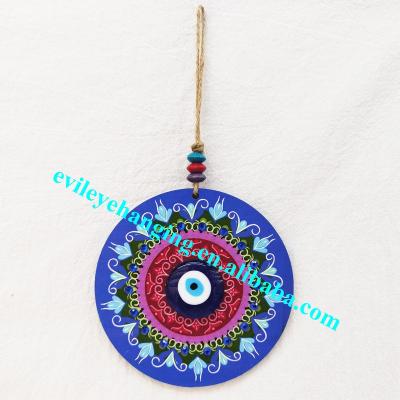 China Folk Multicolor Evil Eye Art Fashion Wood Circle Amulet Art Patterned Wall Hanging Blue Home Decoration for sale