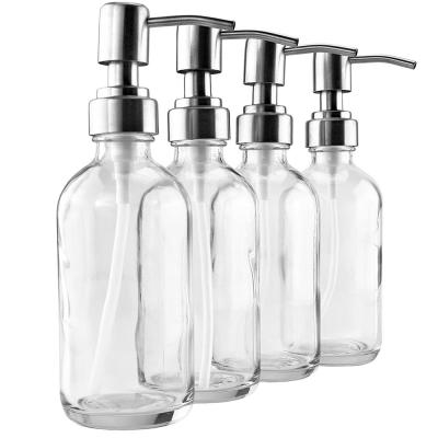 China 8oz Eco - Friendly Light Blue Glass Boston Round Bottles With Stainless Steel Lotion Pumps for sale