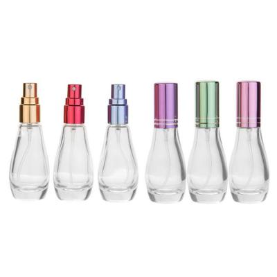 China Eco-friendly Transparent Portable Rolling Shape 15ml Glass Perfume Spray Bottle With Aluminum Sprayer for sale