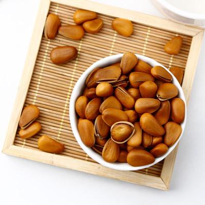 China Food vendors in the northeast supply wild red pine nuts in large quantities and sell the fried pine nuts at a low price for sale