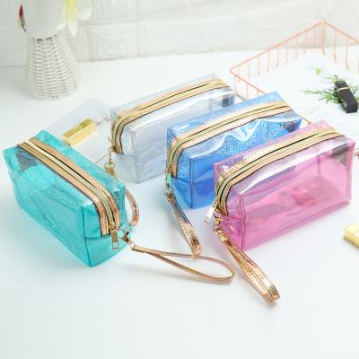 China Custom Clear PVC Resitant Cosmetic Bag Women Water Zipper Travel Transparent Glitter Makeup Bag for sale