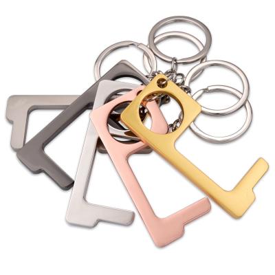 China Non-contact Retractable Brass Door Opener Metal Key Chain Non-contact Tool for sale