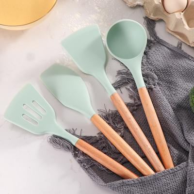 China Sustainable Silicone Kitchen Cookware Set Wooden Handles 12Pcs Kitchen Utensils Heat Resistant Spatula Set for sale