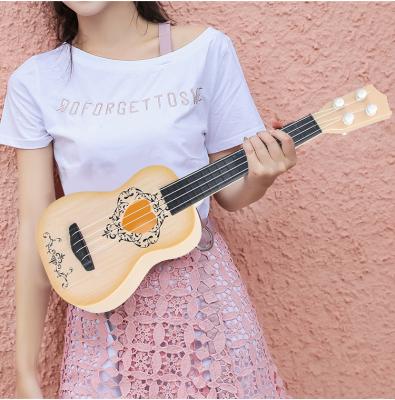 China Mini Guitar Part Four-String Ukulele Toy Children Boy Little Guitar Music Enlightenment Instrument Toy Educational Guitar Model for sale