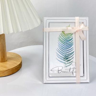 China Eco-friendly Fashion Durable Metal Mirror Frame Transparent Casting Aluminum Photo Picture Frame With Bowknot for sale