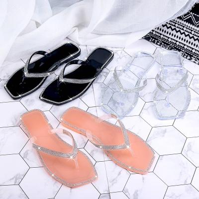 China The hottest fashion trend ladies slippers crystal lady fashion filp collapses summer women colorful diamond jelly flip flops for sale