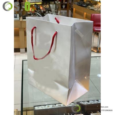 China Jewelry Store Package Customized Rivet Solid Color Gift Thick Paper Bag With Logo Customized With Different Color And Size for sale