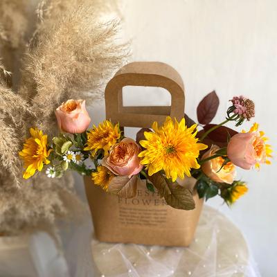 China Hot Selling Recycled Materials Aier Flower Kraft Paper Bag For Flower Packaging Bag Flower Stand for sale