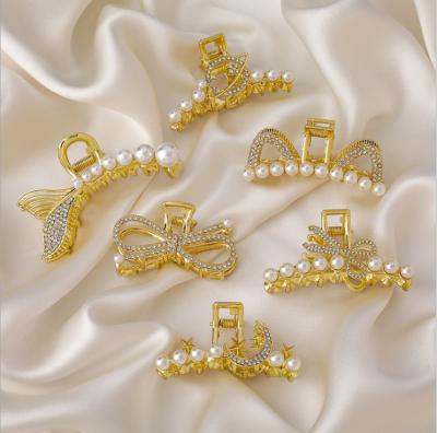 China Fashion 2021 New Women Hollow Star Bow Metal Hair Claw Vintage Geometric Pearl Elegant Gold Crystal Hair Clip Accessories for sale