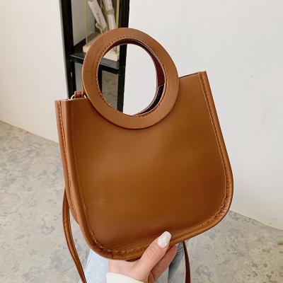 China 2021 hot sale fashion solid color women bucket bags cross - body ladies PU leather handbags with circular ring for sale