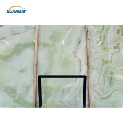 China Modern Luxury Natural Jade Stone Backlit Green Onyx Slabs For Floors Wall Tiles for sale