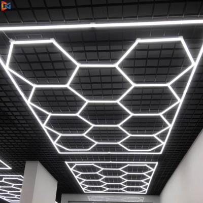 China Aluminum+PC Cover Linear Garage Lights 8Feet *16Feet Deformable Led Hexagon Lamp Modular Hanging Honeycomb Retail Led Hexagonal LED Light for sale