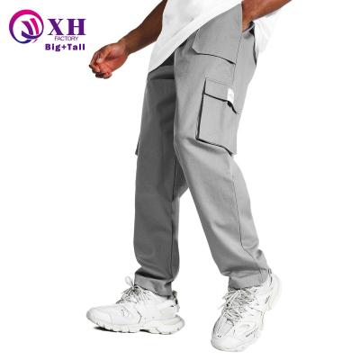 China Fashion street fashion oversized men's casual pants and cargo multi-functional men's canvas pocket pants oversized pants for sale