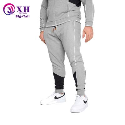 China Custom Made High Quality Gray Running Tracksuit Gym Joggers Color Block Logo Men Tracksuit Elastic Cord Elastic Drawstring Pants Plus Size Mens Joggers for sale