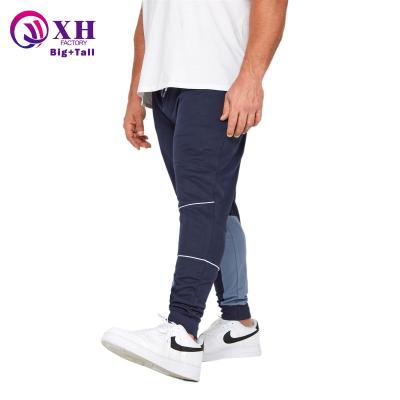 China Viable Custom Logo Men Cut And Sew Track Pants Fashion Casual Color Block Running Gym Fit Sweatpants Plus Size Mens Joggers for sale