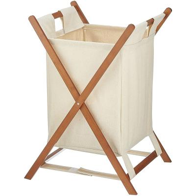 China Wooden Bamboo Handles Laundry Organizer Cabinet With Two Removable Cloth Bags For Bathroom for sale