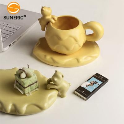 China Stocked Exquisite Snowball Shape Handmade Animal Pet Bear Porcelain 3D Ceramic Cup Coffee and Tea Cup with Saucer for sale