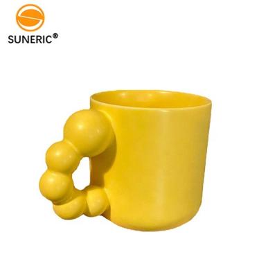 China Fashion Design Cute Stocked Beads Handle Ceramic Mug Set Nordic Ceramic Cup With Saucer Oval Coffee Cup Set for sale