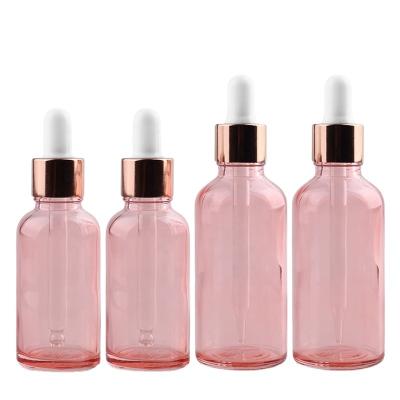 China Cosmetic skincare packaging 5ml 10ml 15ml 20ml 30ml 50ml 100ml Pink Glass Dropper Bottle For Essential Oil Serum Toner With Rose Gold Cap for sale