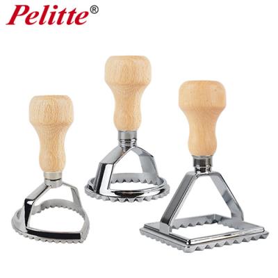 China Disposable Zinc Alloy Italy Ravioli Stamp Set Dought Cutter With Wooden Handle for sale