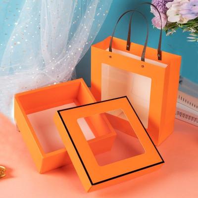 China Handmade Valentine's Day Portable Perfume Box Printing Elegant Square Paper Box Packaging With Handle for sale