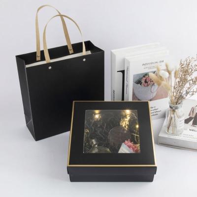 China Handmade Gift Box Printing Elegant Skincare Square Box With Handle Portable Valentine's Day Christmas Rigid Window Box With Lid Bag for sale